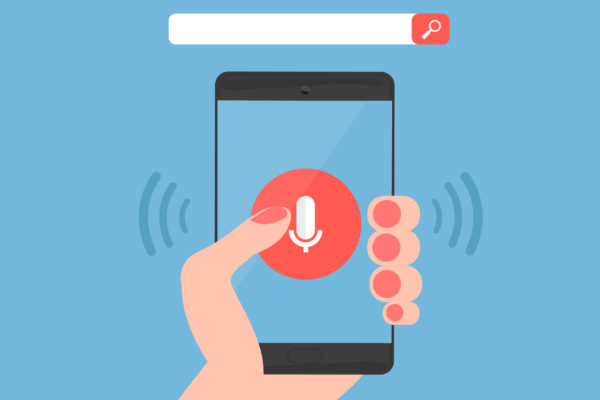 Hand using a phone for voice search